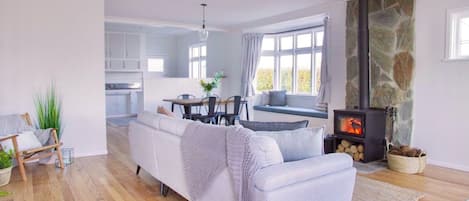 Lounge with wood burner, heat pump & double glazing.