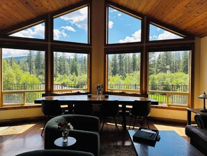 Stunning river & forest views. Custome dining room table for seating of 8.