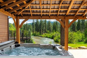 7-person jacuzzi with river view.