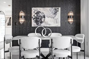 Large dining room table comfortably accommodates 6 people.
