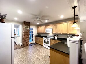 Open kitchen overlooking second living room.