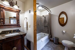 The shower with Jacuzzi tub is located in the room