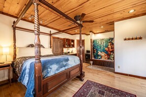 A view of the room from the other side shows the shower and kitchenette in the background