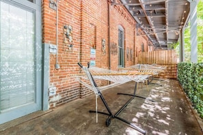 Private Balcony with 2 hammocks, table, & string lights