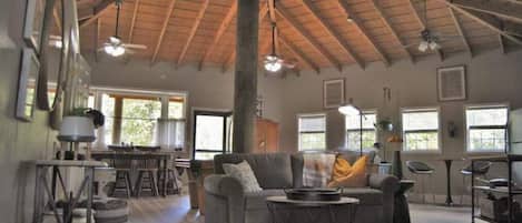 Open floorplan. Vaulted wooden ceiling. Many windows, natural light & pond views