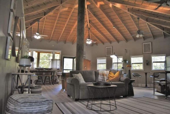 Open floorplan. Vaulted wooden ceiling. Many windows, natural light & pond views