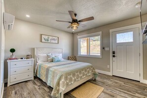 Comfortable queen bed with fresh farmhouse feel.