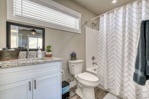 Full bathroom with tub and shower