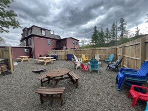 1 of 2 outdoor amenity spaces! We have 2 firepits, BBQs, Adirondack chairs, fire starter, fire wood, games and more!