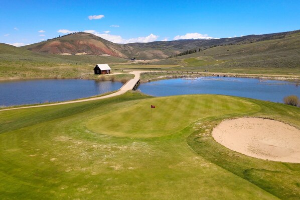 Perfect your swing with a round of golf amidst the sweeping landscapes of Granby's lush valleys at Grand Elk Clubhouse Golf Course.