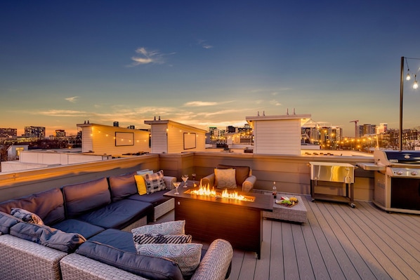 4th Floor: Private rooftop patio with outdoor seating, fire pit, BBQ grill, and amazing city views.