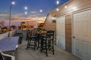 4th Floor: Private rooftop patio with outdoor seating, fire pit, BBQ grill, and amazing city views.