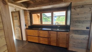 Kitchen counter, door to toilet on floor level one