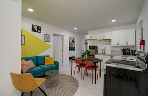 This multi-functional space is perfect for lounging on the couch, conversing with friends, and grabbing a bite to eat!