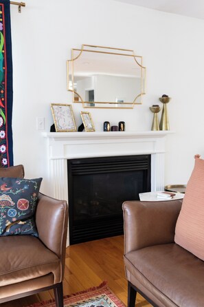 Indoor fireplace, natural gas powered. There is a light switch to ignite.