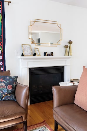 Indoor fireplace, natural gas powered. There is a light switch to ignite.
