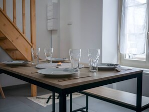 "Welcoming Atmosphere: Dining Table in Living Space"