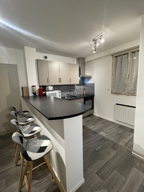 "View from La Feuillette kitchen bar with bar chairs"