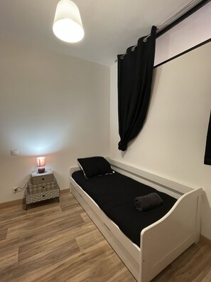 "Cosy room with single bed and cozy atmosphere".