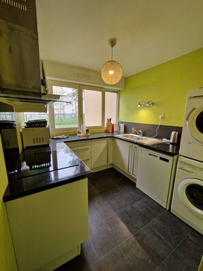 "Fully equipped kitchen in chartreuse yellow".