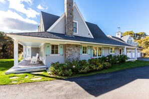 The home features a spacious front porch and plenty of parking
