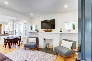 Living Room with decorative fireplace and TV