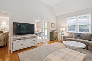 French doors take you from the dining space to the TV room