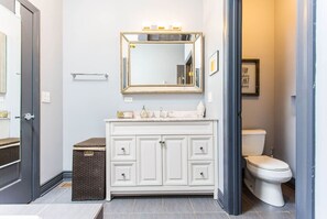 Spacious 48" free standing vanity with a rectangular mirror for a touch of modern luxury in the bathroom.