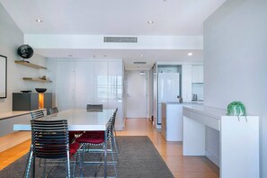 Enjoy meals together at home with a central dining table seating six.