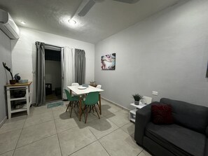 Livingroom/ diningroom with entrance to the garden
