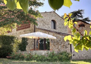 Exterior: fienile (farmhouse) Le Rose patio viewed from our inner olive grove