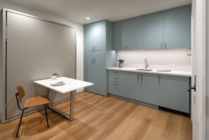 During the day the murphy bed can be folded to a dining table.