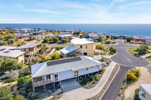 Arrive to coastal calm, where native gardens and birdsong set the scene.