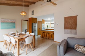 The dining area and kitchen create the perfect space for meals and memorable moments.
