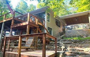 Exterior: Enjoy our deck with trees around and steps to a cozy house. It's a quiet place to sit and breathe fresh air.