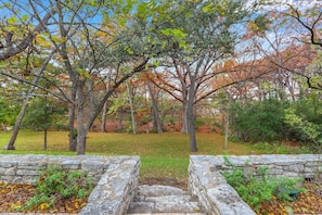 Stairs leading down to the enchanting backyard space
