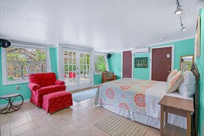 Bright bedroom featuring French doors with direct access outside