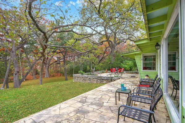 Around the side of the home, there is more outdoor seating