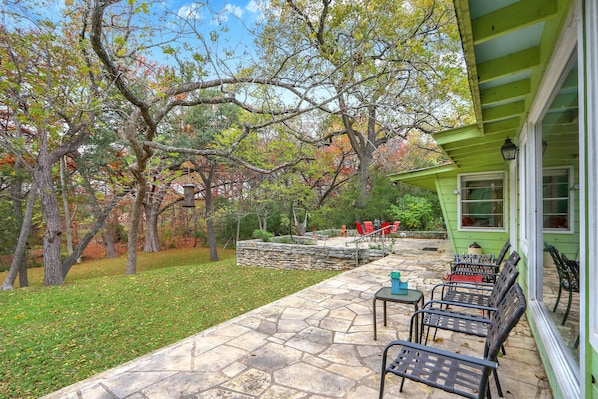 Around the side of the home, there is more outdoor seating