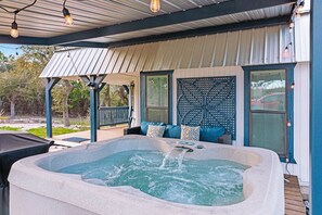 Private hot tub under the large covered deck.