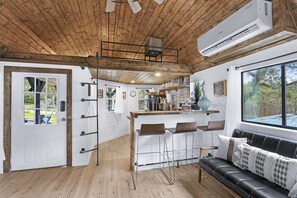 This unique cottage has one bedroom and two separate lofts with Queen beds.