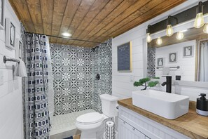 The ensuite bathroom has a large walk-in shower.