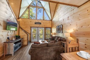 Living room with comfortable sofas and smart TV. Vaulted ceiling!
