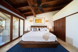 Wake up to ocean views from this elegant master bedroom retreat.