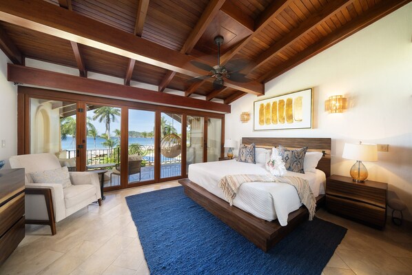 Wake up to ocean views from this elegant master bedroom retreat.