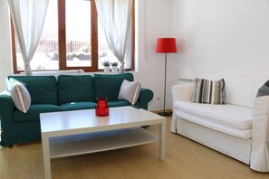 Cozy Living Room  With a TV, Dining Table for 4 Persons