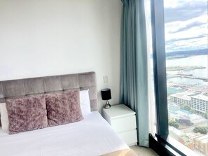 Master bedroom with En-suite bathroom, Closet, Bedside table, Lamp and Seaview.