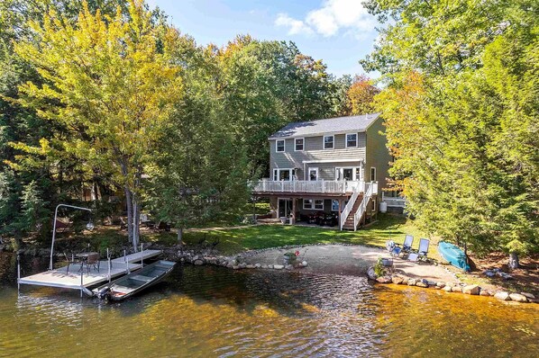 backyard paradise with 105 feet of waterfront private beach & a personal dock