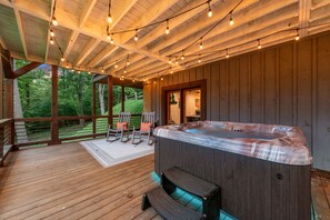 Bottom-level patio (attached to game room) with hot tub.