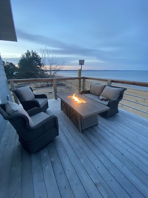 Comfy lounge area overlooking the lake with fire table.  